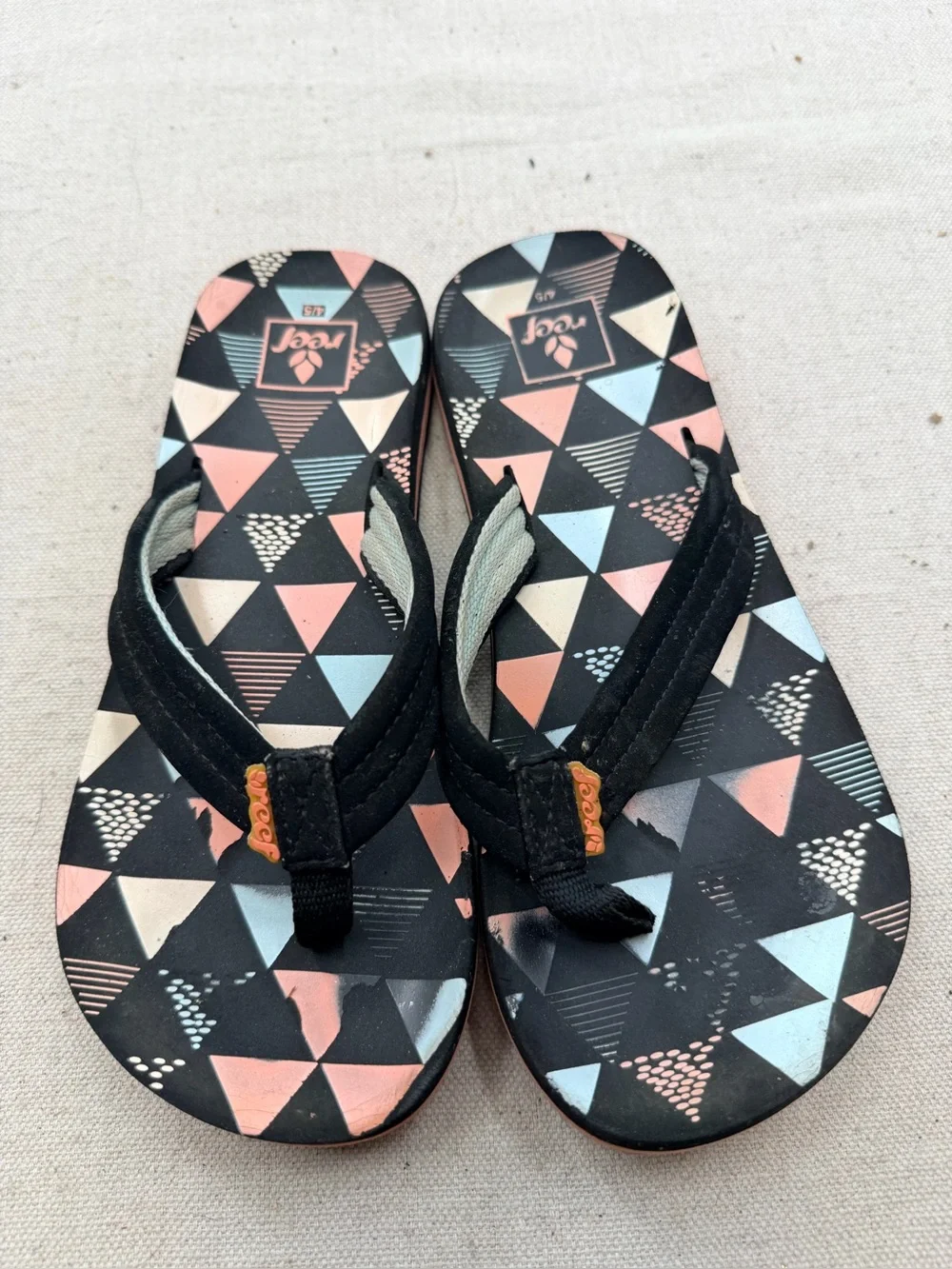 Reef Black Flip Flops with Coral & Light Blue Triangle Print